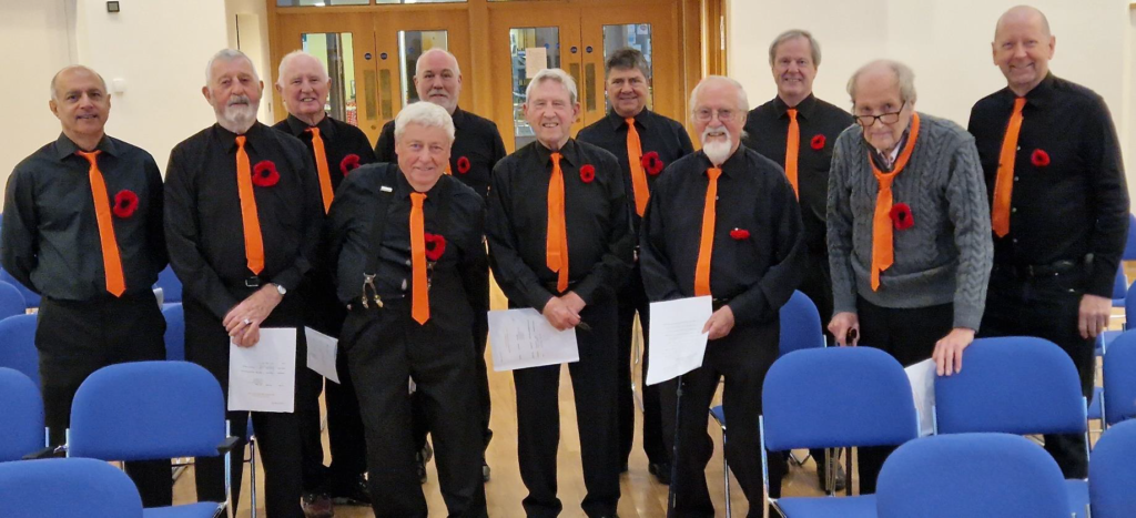 Windmill Songmen with distinctive orange ties in 2023